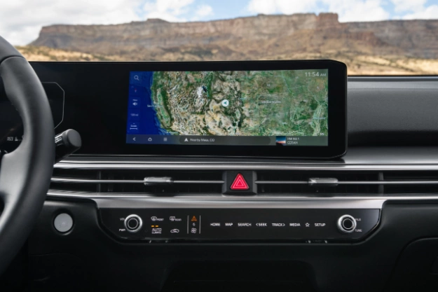 2024 Kia Sorento interior view of the full dashboard, featuring the dual panoramic display showing a map of North America