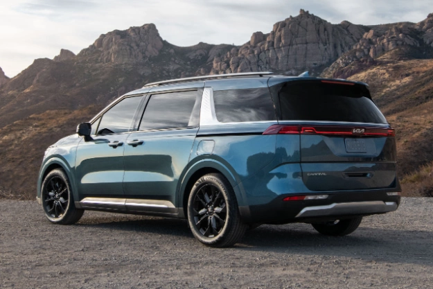 2024 Kia Carnival Parked Off-Road Near The Canyons Rear Three-Quarter View 